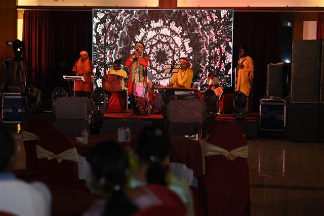 Live band performing on stage in a banquet hall
