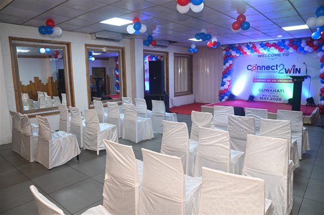 Conference venue with stage backdrop and seating