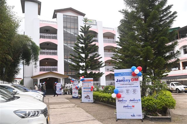 Hotel entrance decorated with event standees and balloons